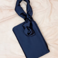 AUGUST NIGHT KNOT CLUTCH IN NAVY SATIN