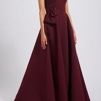 AMSALE FAILLE GOWN WITH ASYMMETRIC BODICE IN RUBY