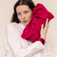 AUGUST NIGHT BOW CLUTCH IN FUSCHIA SATIN