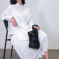 AUGUST NIGHT BOW CLUTCH IN BLACK SATIN