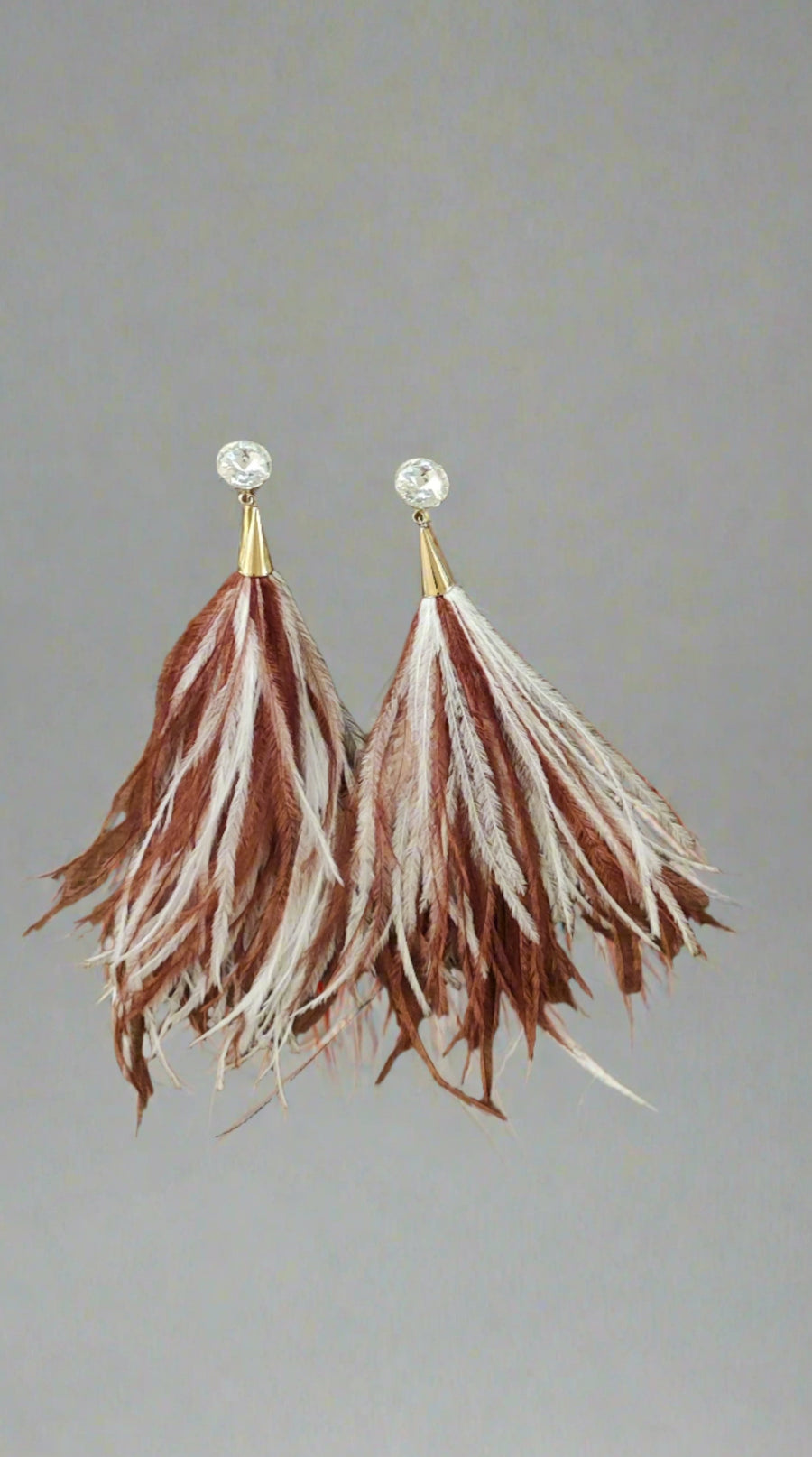 ROSANTICA LONG FEATHER TASSEL CLIP-ON EARRINGS IN RUST/CREAM