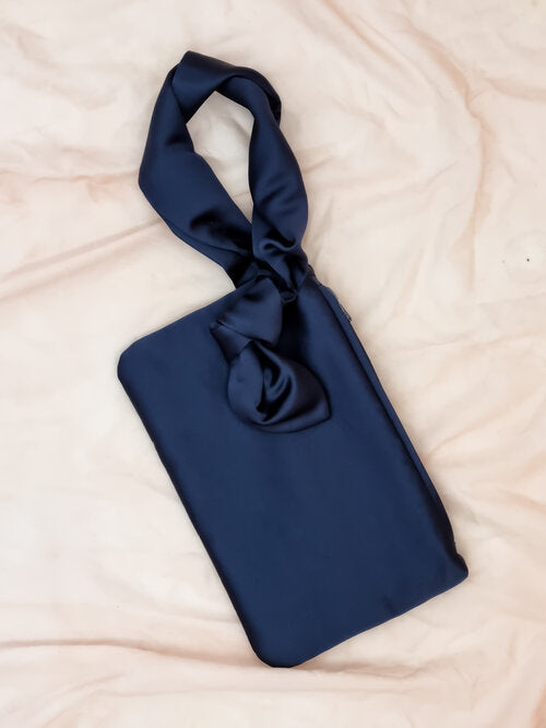 AUGUST NIGHT KNOT CLUTCH IN NAVY SATIN