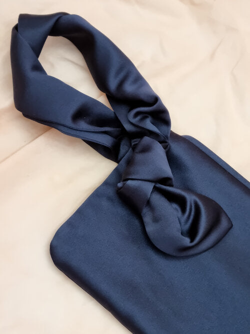 AUGUST NIGHT KNOT CLUTCH IN NAVY SATIN