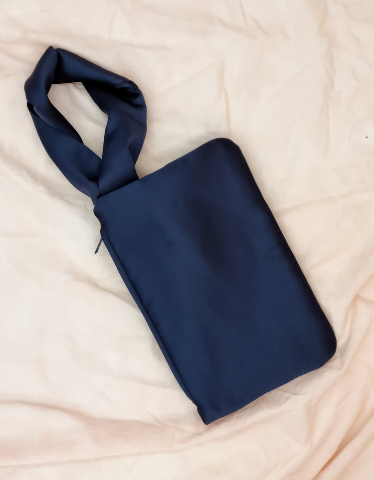 AUGUST NIGHT KNOT CLUTCH IN NAVY SATIN