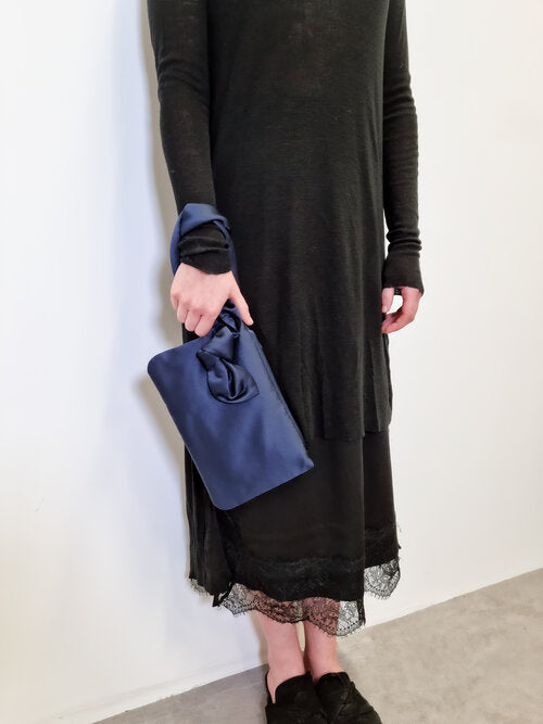 AUGUST NIGHT KNOT CLUTCH IN NAVY SATIN