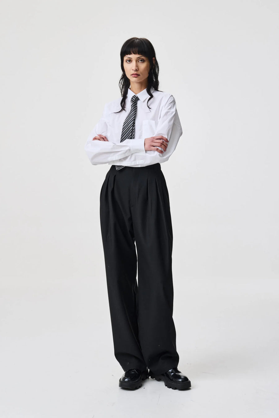 ADNYM TUCK TROUSERS IN BLACK