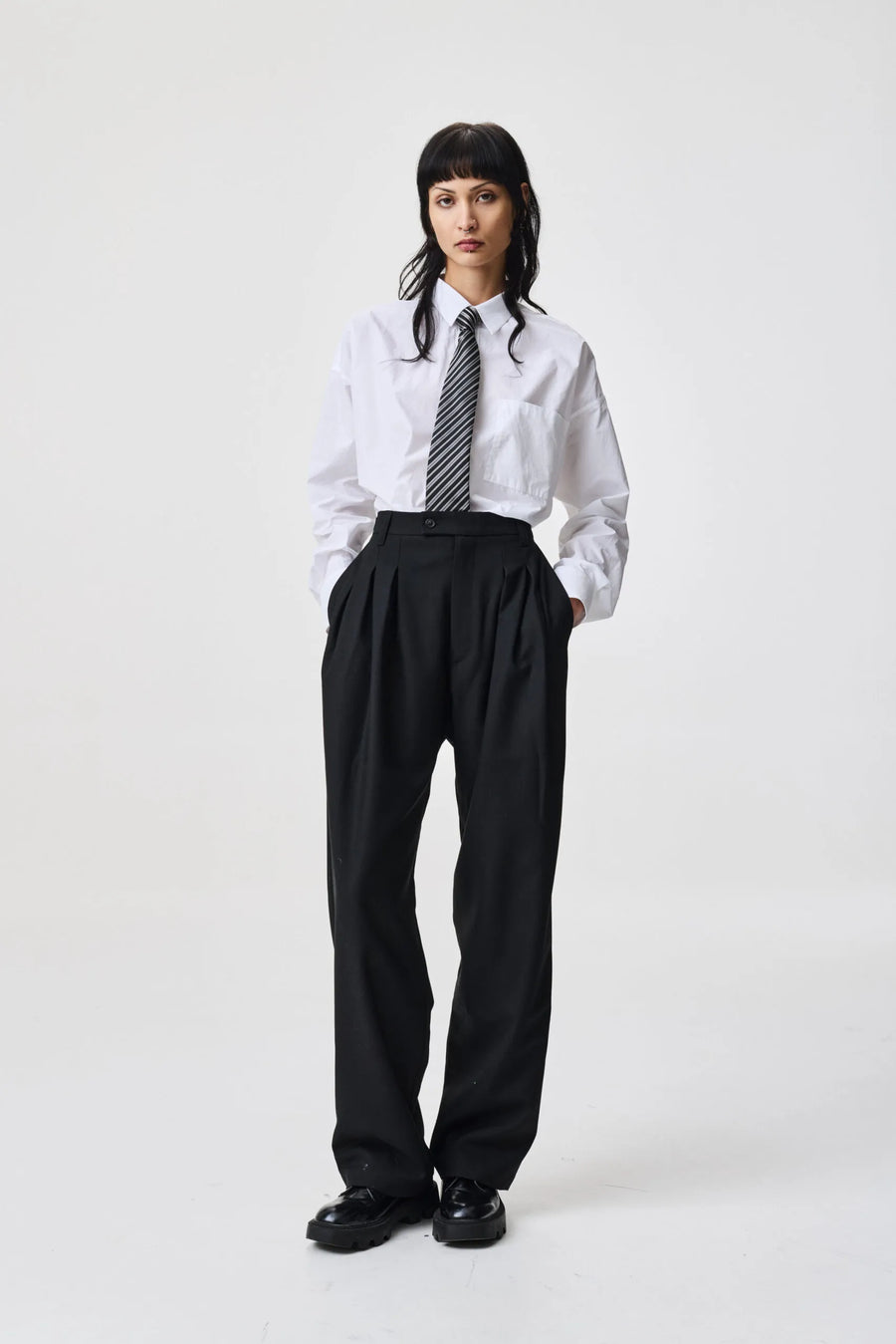 ADNYM TUCK TROUSERS IN BLACK