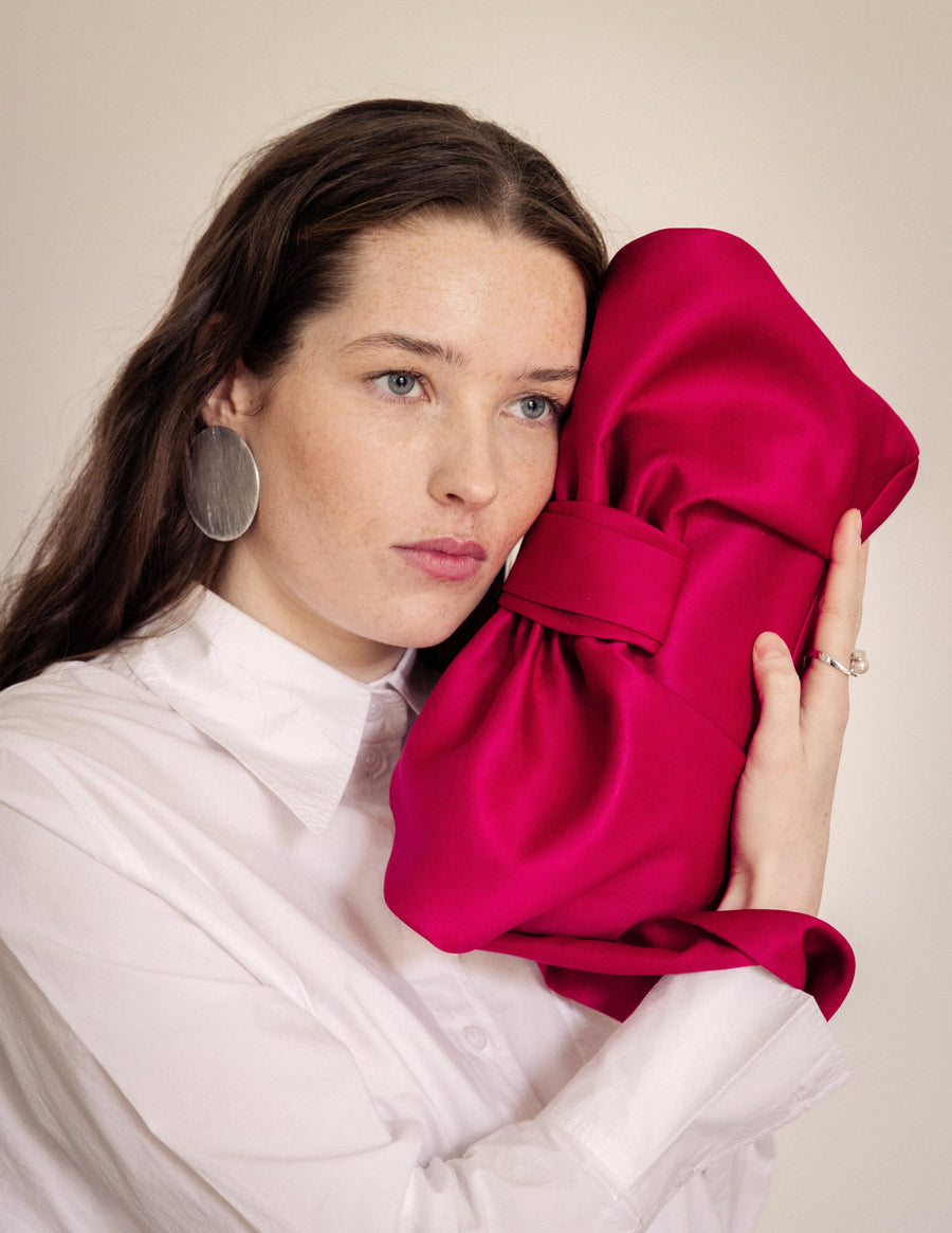 AUGUST NIGHT BOW CLUTCH IN FUSCHIA SATIN