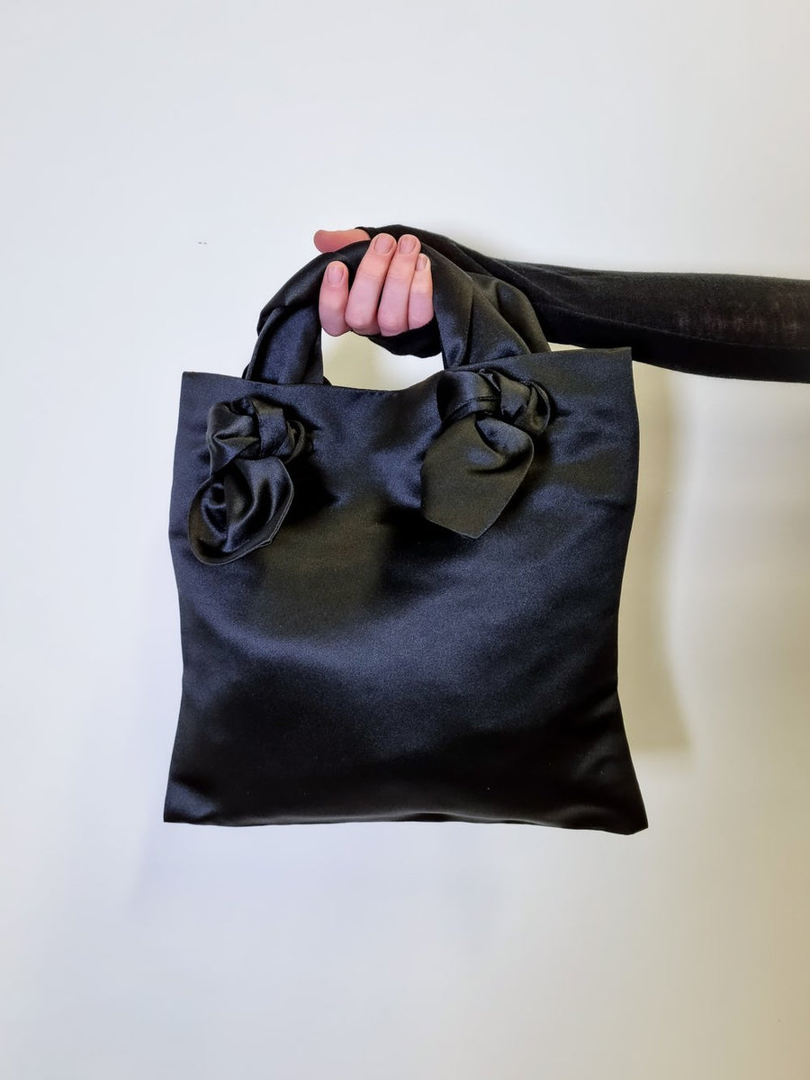 AUGUST NIGHT MINI KNOT TOTE WITH CROSSBODY STRAP IN BLACK SATIN